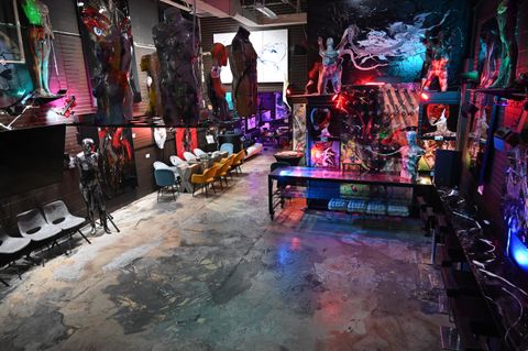 Lively studio energy with canvases in progress