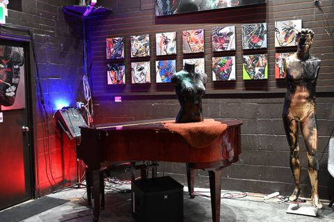 Creative duo collaborating on a shared painting