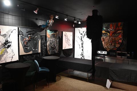 Lisabel guiding a guest through brush techniques